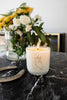 Horse soy wax candle in a clear glass tumbler with a horse illustration and lit wick.
