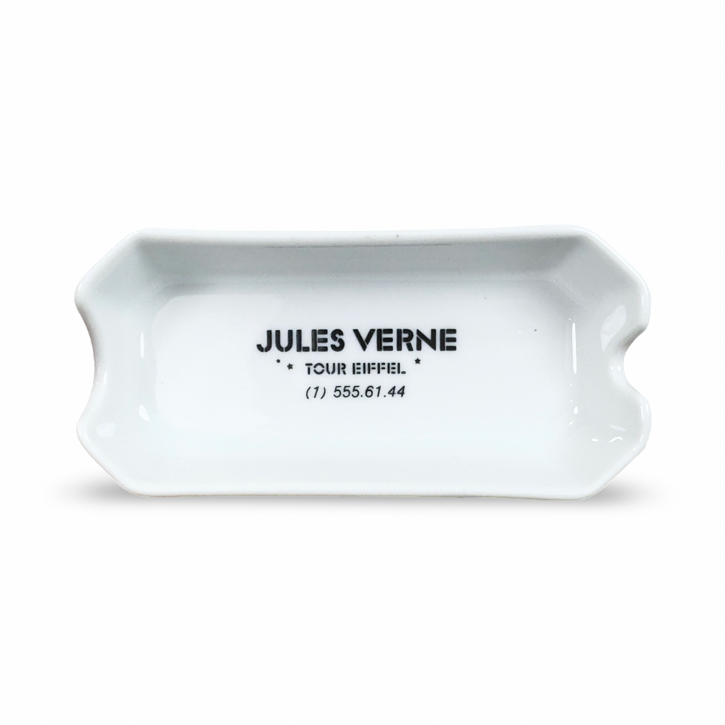 White ceramic ashtray with JULES VERNE logo on front