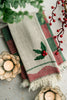 Cream tea towel with holly berry applique and green/red plaid stripes, fringed hem