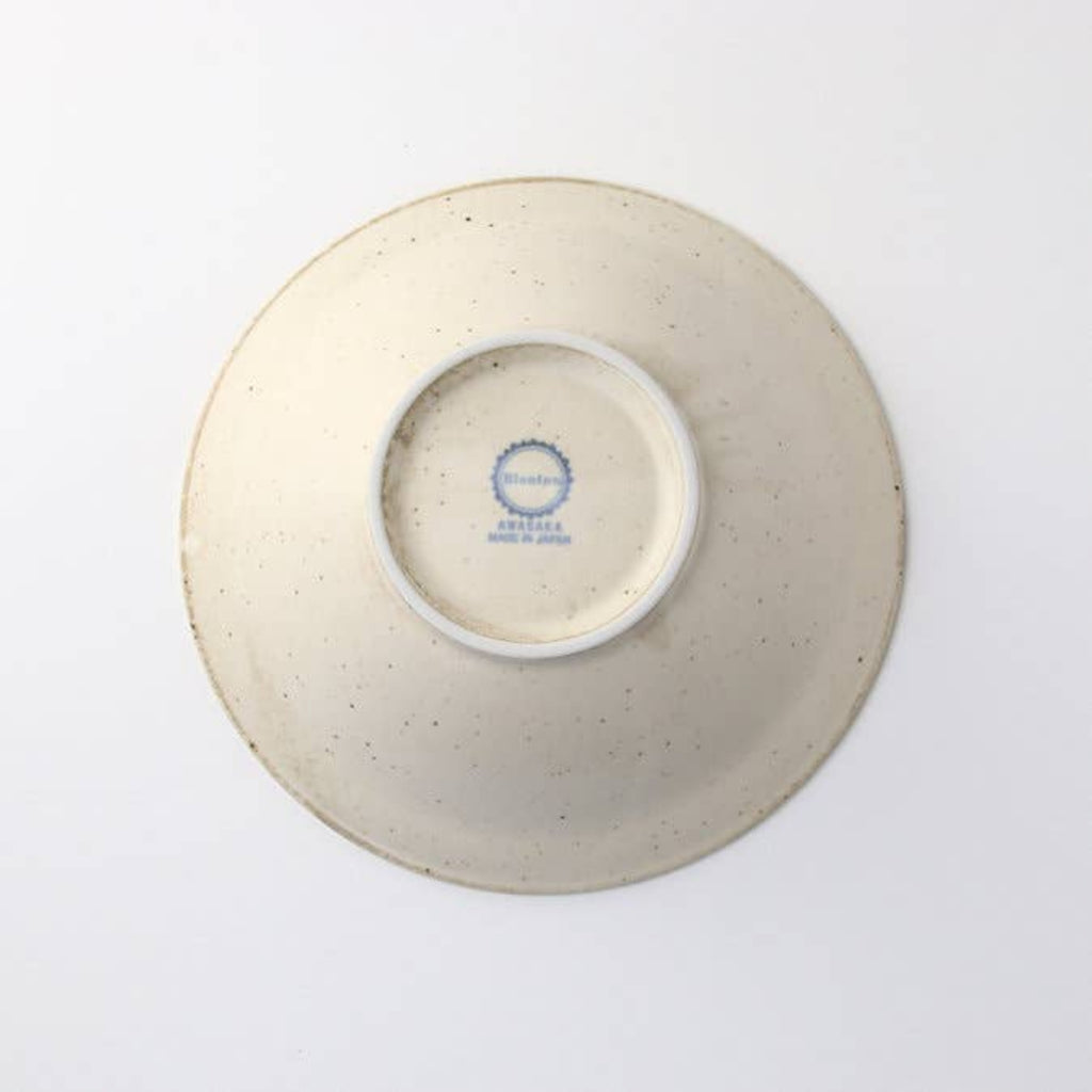 Japanese porcelain bowl base with blue stamp and speckled off-white glaze