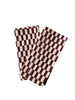 Set of 2 checkered napkins, brown and white, folded and slightly overlapping