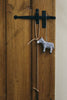Paper mache polar bear ornament, light gray, hanging from curved cord