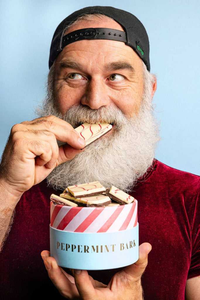 Peppermint bark tin with red-and-white striped lid and Peppermint Bark label