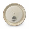 Bottom view of round ceramic ashtray with embossed maker stamp and text