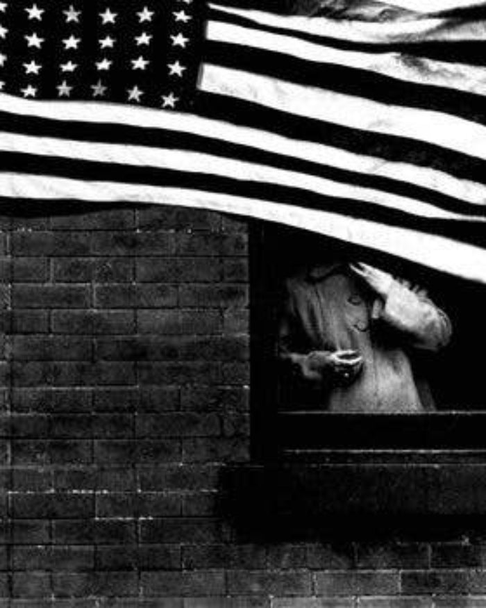 American photography print with American flag and person in window