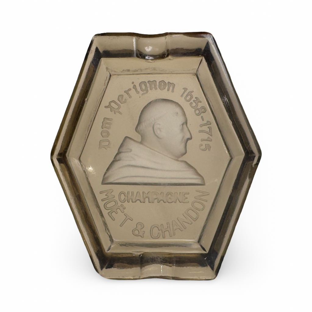 Hexagonal bronze ashtray with engraved bust and decorative border