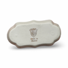 Light beige ceramic ashtray with scalloped rim and crest stamp on base.