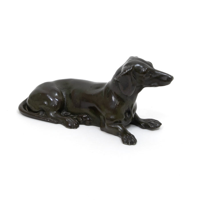 Glossy dark green lying dog figurine