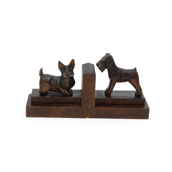 Antique-style dog bookends, two seated dogs on dark wood base with central divider.