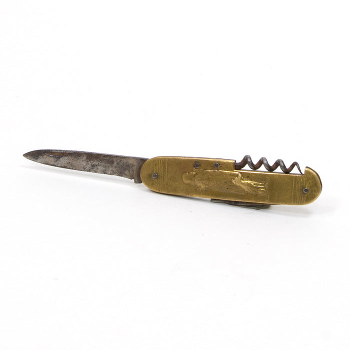 Antique utility knife with gold brass handle and dark steel blade