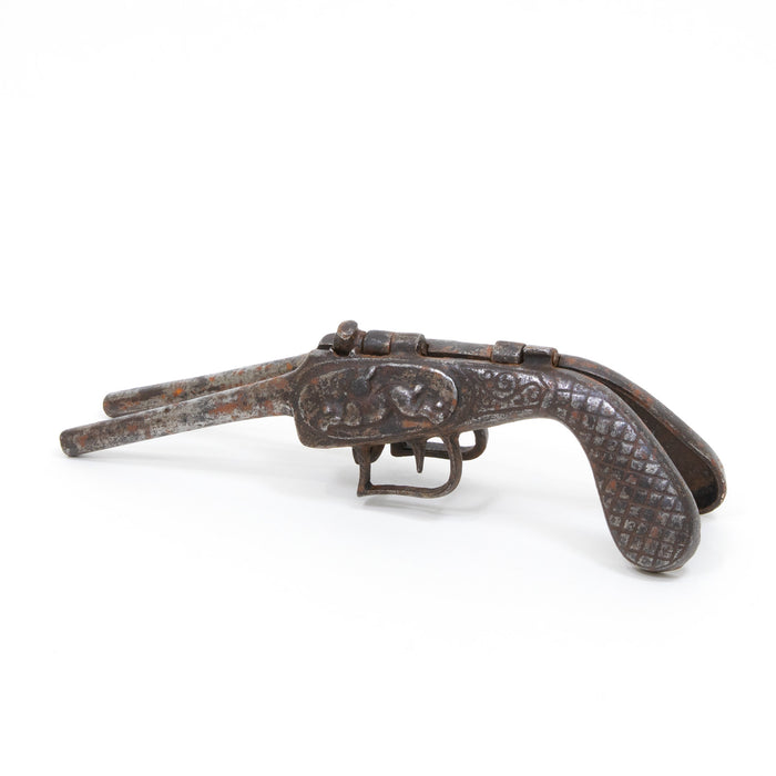 Vintage cast iron boot remover tool with curved handle and gripping mechanism