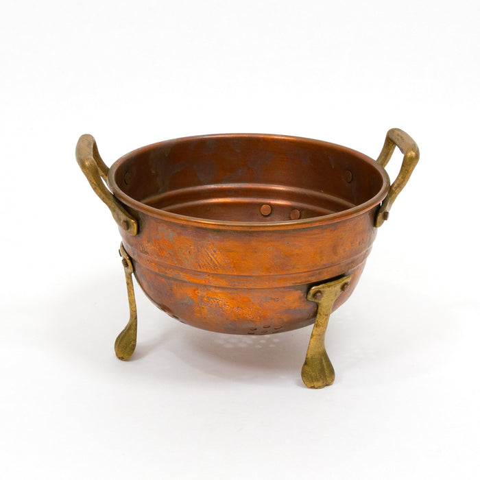 Vintage copper colander with brass handles and three tripod feet
