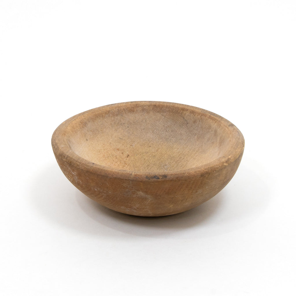 Carved brown bowl with shallow round interior and wide rim