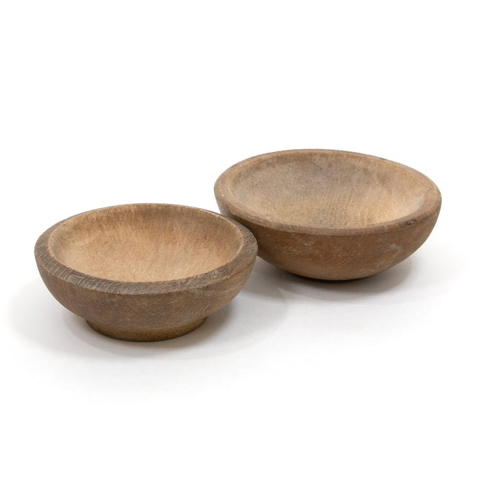 Set of two carved brown bowls with rounded sides and smooth interior