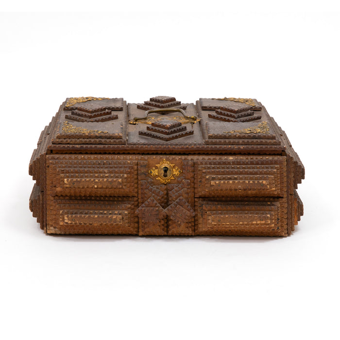 Decorative wooden trinket box with brass medallion and geometric inlay, closed