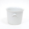 White stoneware ice bucket with front arched handle and round open top