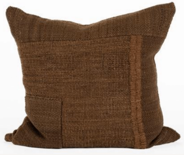 Brown textured pillow on a white background