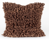 A square-shaped, brown loom pillow with a textured, shaggy appearance, made from natural wool.