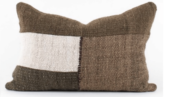 A square-shaped pillow with a two-tone color scheme, featuring a combination of green and white textures.
