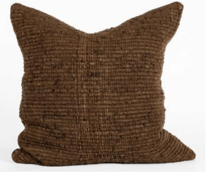 Brown textured pillow on a white background