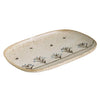 Speckled oval porcelain plate with blue floral vine stripe