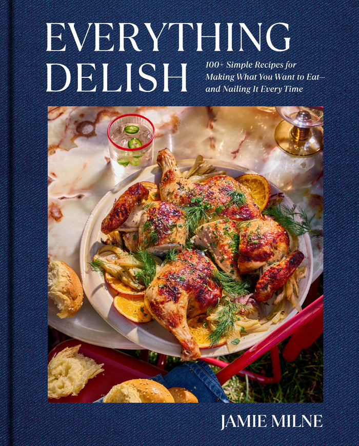 Everything Delish cookbook with roasted chicken photo on blue cover