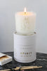 Horse soy wax candle in glass with a lit wick, shown atop its Spirit product box.
