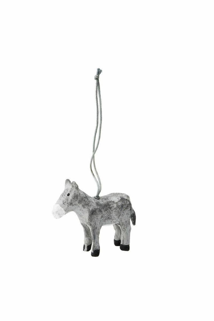 Paper mache polar bear ornament in light gray, hanging from thin cord