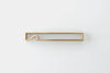 Brass bottle opener with flat rectangular handle and curved pry hook