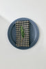 Linen check napkin with green sprig, neatly folded
