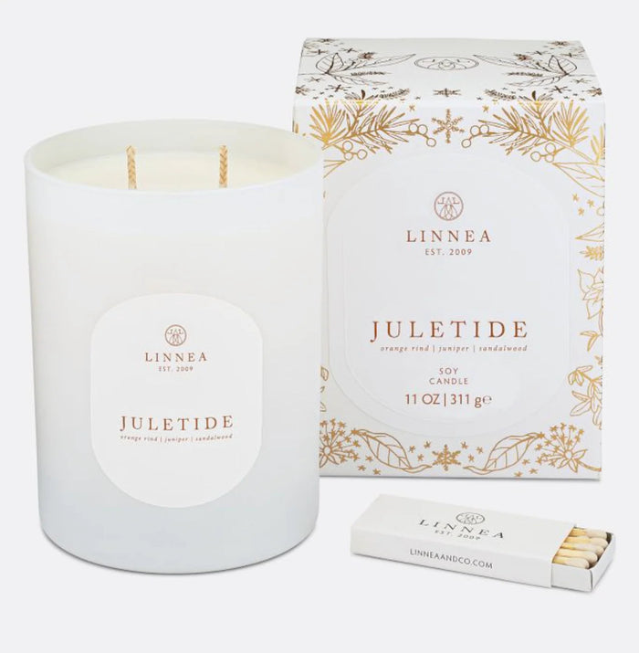 Linnea Juletide candle in white jar with gold wax wick, presented with patterned gift box