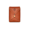 Tan leather playing card case with crisscross stitching and brass snap closure